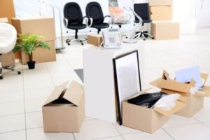 Packed office supplies in boxes during an office move.