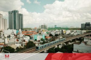 City skyline with elevated train passing through urban neighborhood