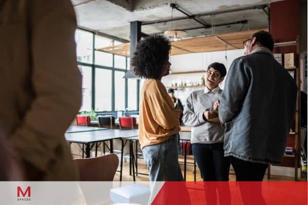 A meeting room with people discussing strategies.