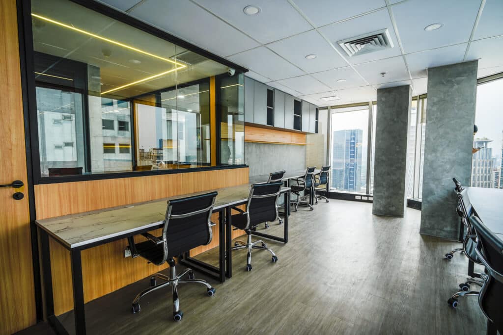 Modern coworking office with desks and city views