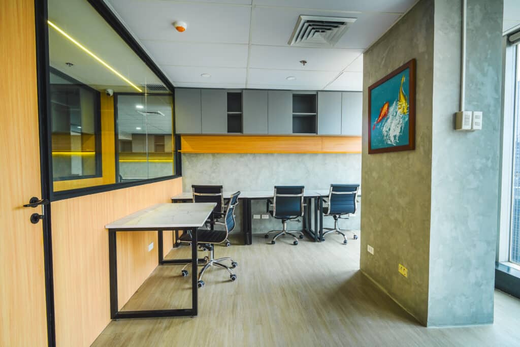 Modern office workspace with glass partitions