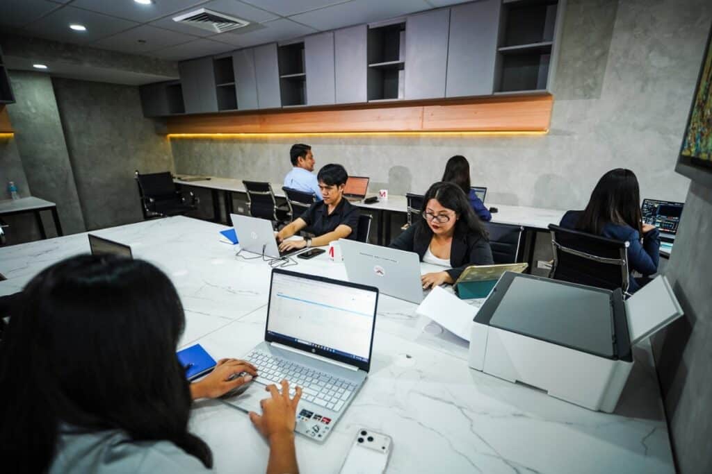 Professionals working in a modern shared office space